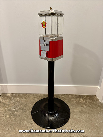 Red and Brushed Silver Acorn mounted on a stand.