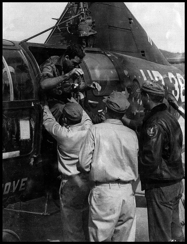 LTJG John Lavra, USN coming off the chopper after being rescued